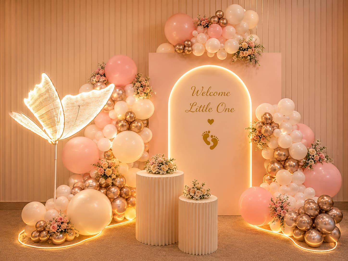 Elegant baby shower with welcome arch and floral decorations